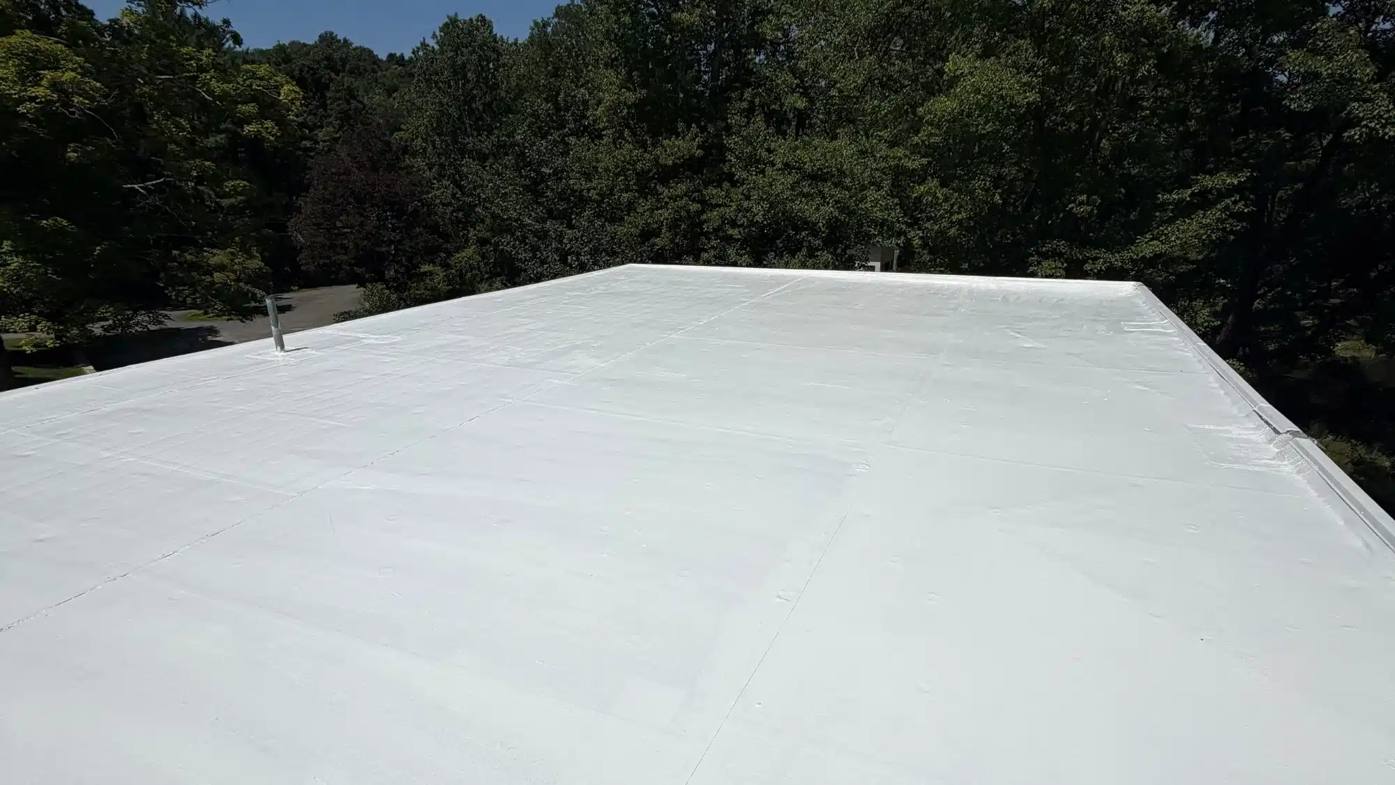 A professional roofing company near me working on a house roof